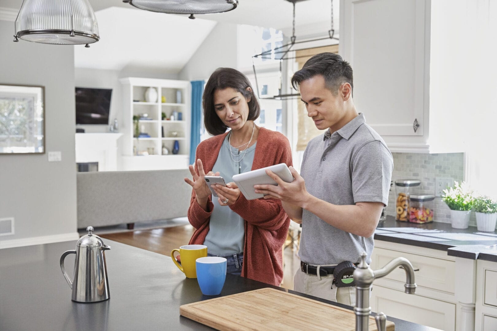 Homeowner reviewing security system with installer